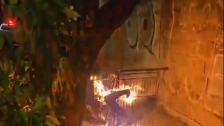 Burning body in shopping trolly