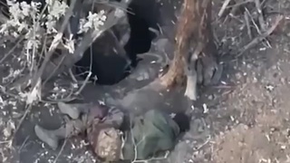 Russian soldier won't let injured comrade into fox hole